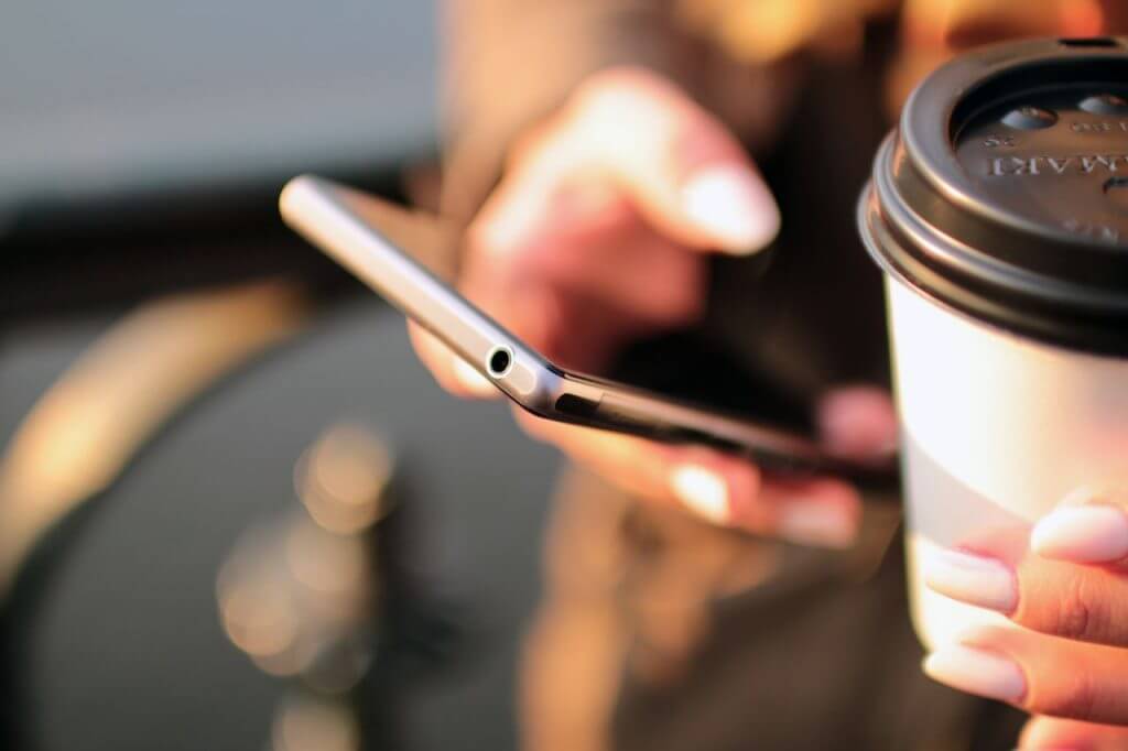 person-holding-smartphone-4831-1024x682